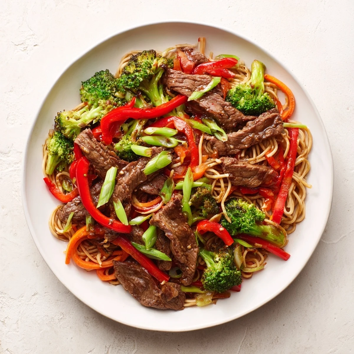 Steaming Easy Beef Stir-Fry with Lo Mein Noodles, a flavorful Asian-inspired dinner ready in 30 minutes.