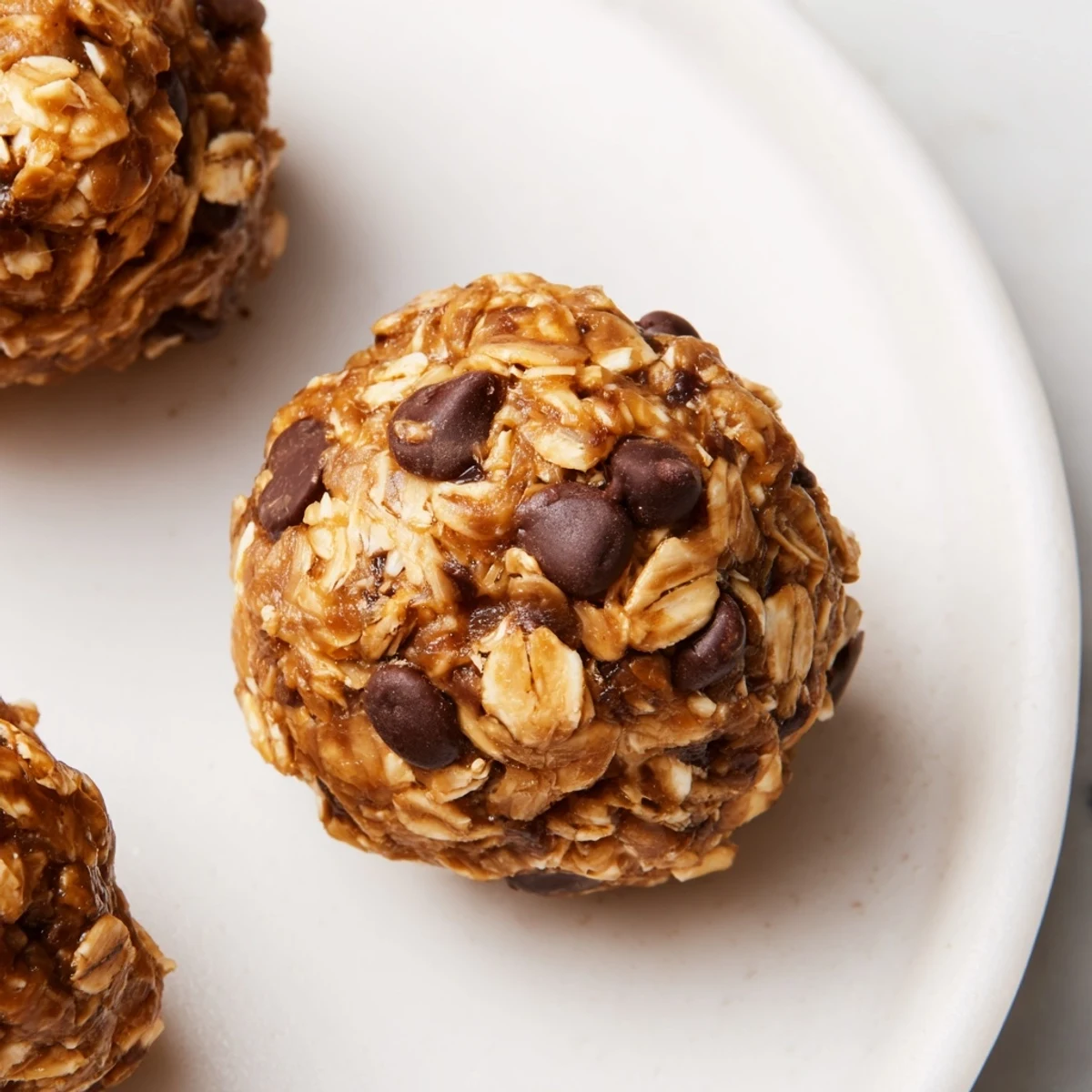 Freshly rolled no-bake peanut butter energy balls, perfect for a grab-and-go burst of energy.