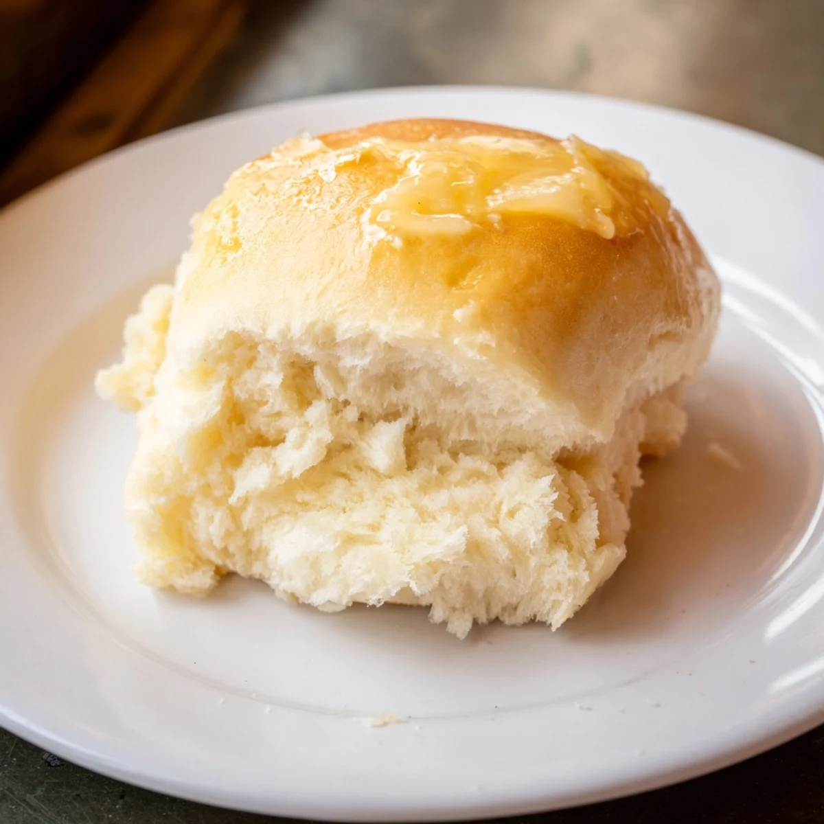 Golden, buttery Quick-Rise Dinner Rolls, fresh from the oven, offering a delightful aroma and soft texture.