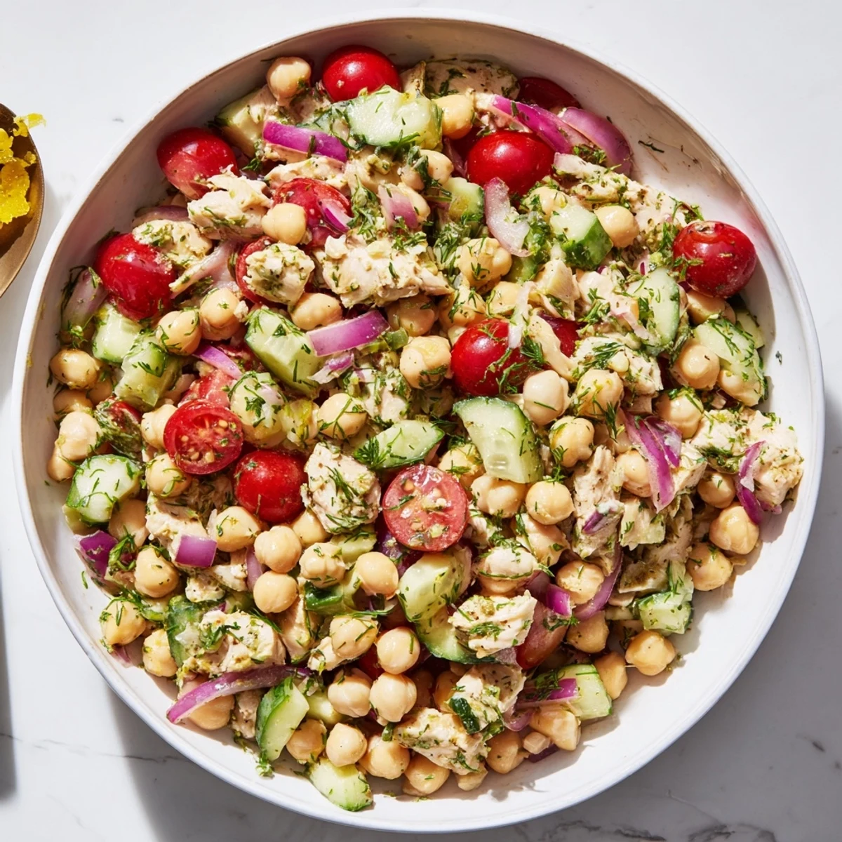 Close-up shot of the flavorful Dense Bean Salad with Lemon-Dill Chicken, drizzled with zesty dressing.