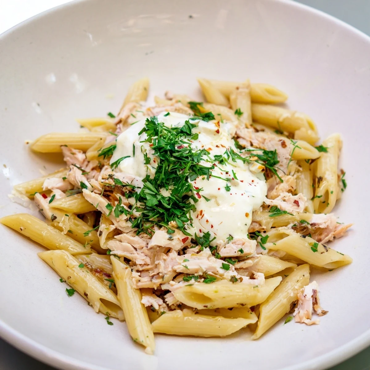 Steaming Turkish Pasta with Ground Turkey: a flavorful, hearty meal with vibrant paprika butter drizzled over.