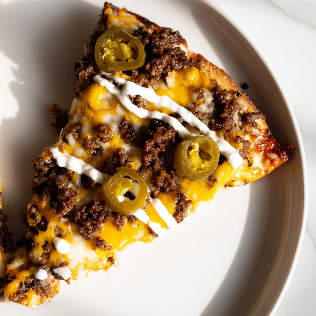 Freshly baked Ground Beef Taco Pizza: imagine the crispy crust, layered with cheese and taco flavors.