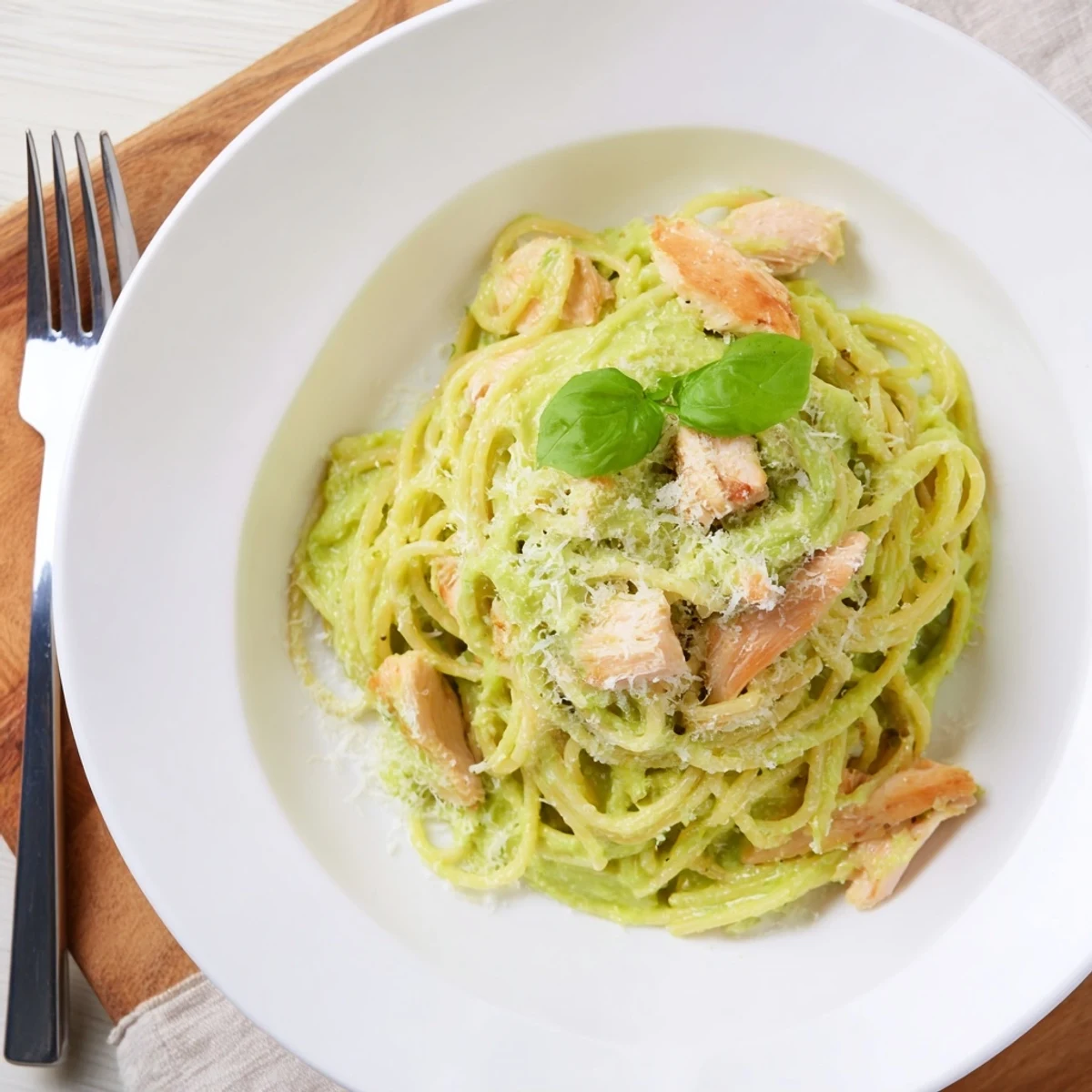 Served warm, this creamy avocado chicken pasta features tender grilled chicken and al dente spaghetti coated in velvety sauce.