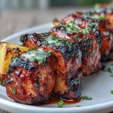 Tender chicken al pastor skewers paired with caramelized pineapple and red onion, bursting with bold, tropical flavors.  