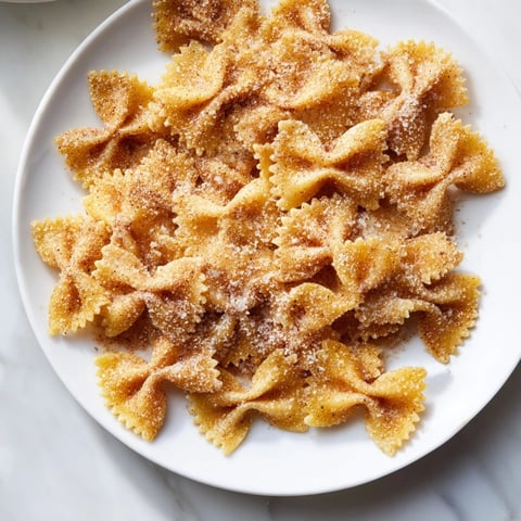 Golden air fryer pasta Christmas crack, crispy and sweet, perfect holiday snack mix.