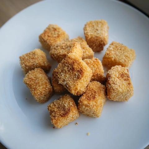 Golden brown, crispy tofu nuggets, ready to dip in creamy vegan ranch and enjoy.