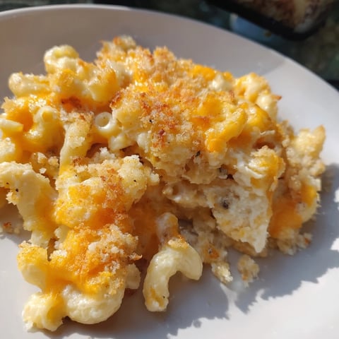 Warm, golden baked mac and cheese bubbling with melted cheese, perfect for a cozy dinner.