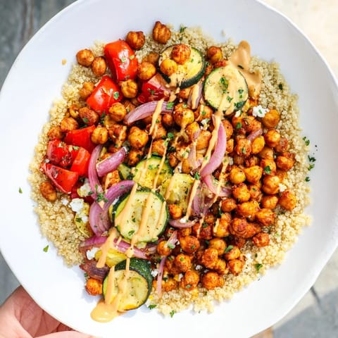 This Mediterranean Chickpea and Veggie Grain Bowl features beautiful bright colors, perfectly roasted vegetables over fluffy quinoa.