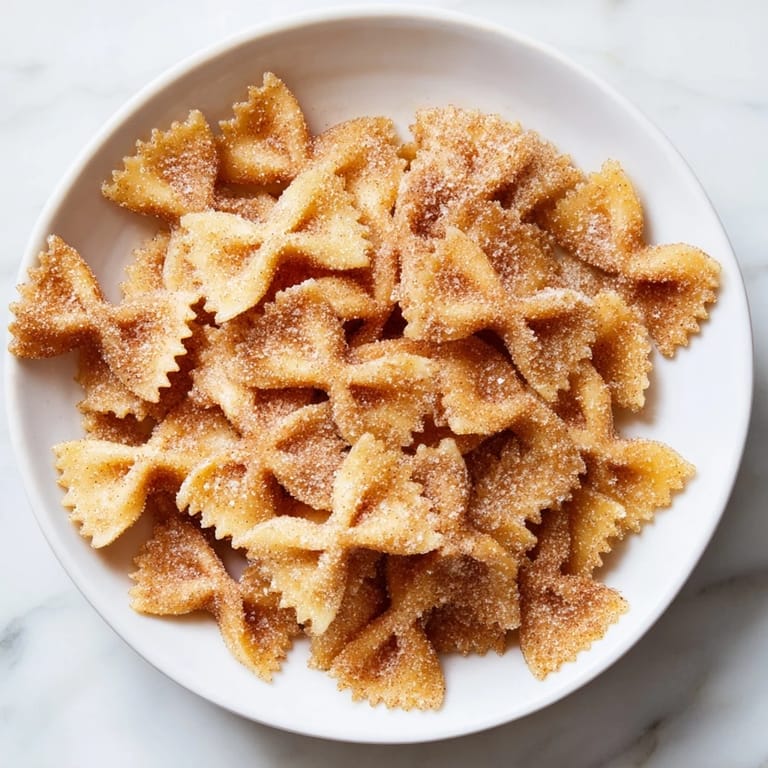 Close-up of cinnamon sugar air fryer pasta Christmas crack, a crunchy, festive treat.