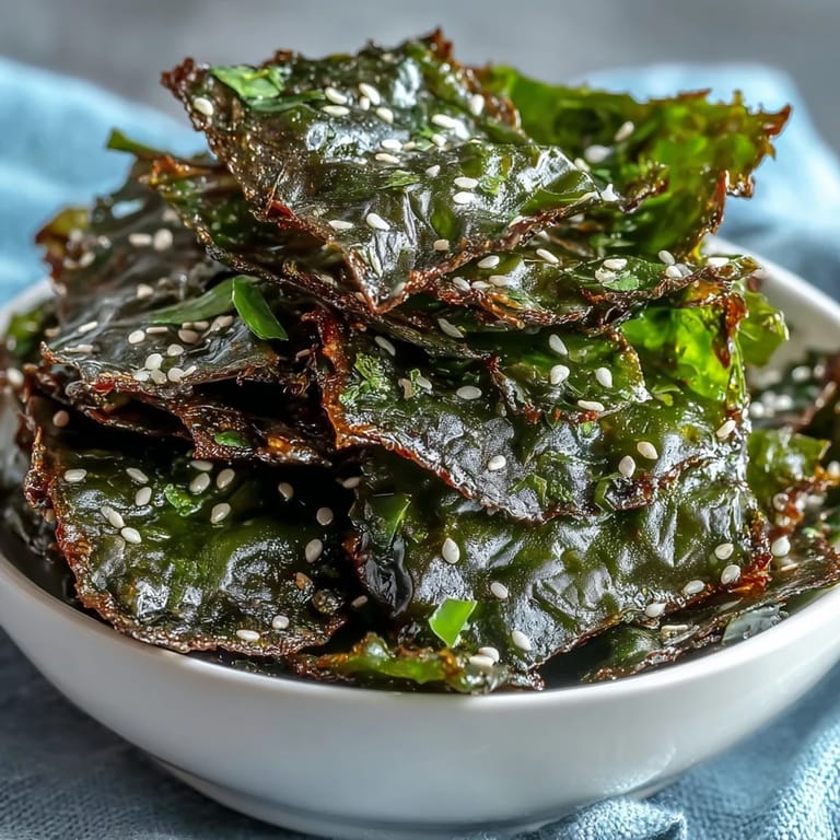 Savory baked seaweed snack chips, invitingly sprinkled with sesame and sea salt.