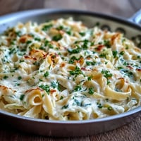 Creamy Cabbage Alfredo with tender fettuccine and caramelized cabbage in a rich Parmesan sauce.
